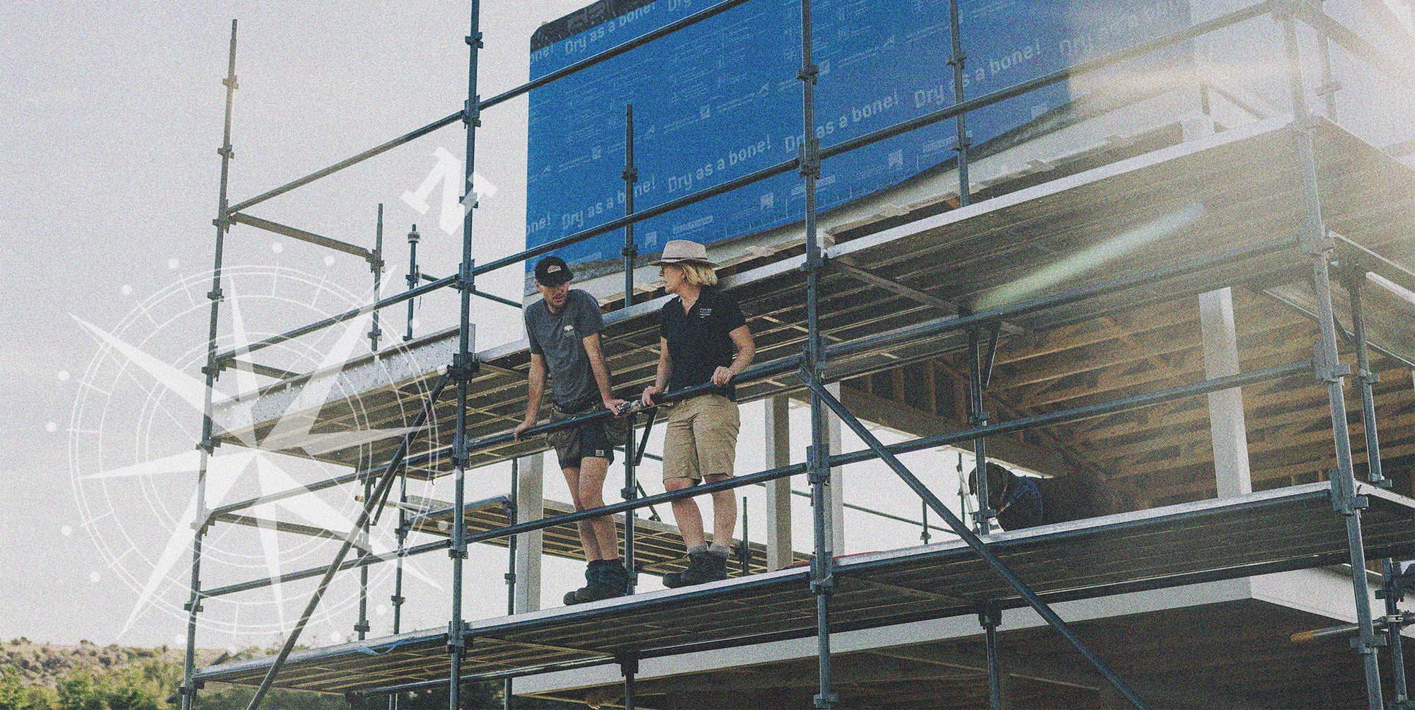 Standing on the scaffolding of the tasting room building in construction