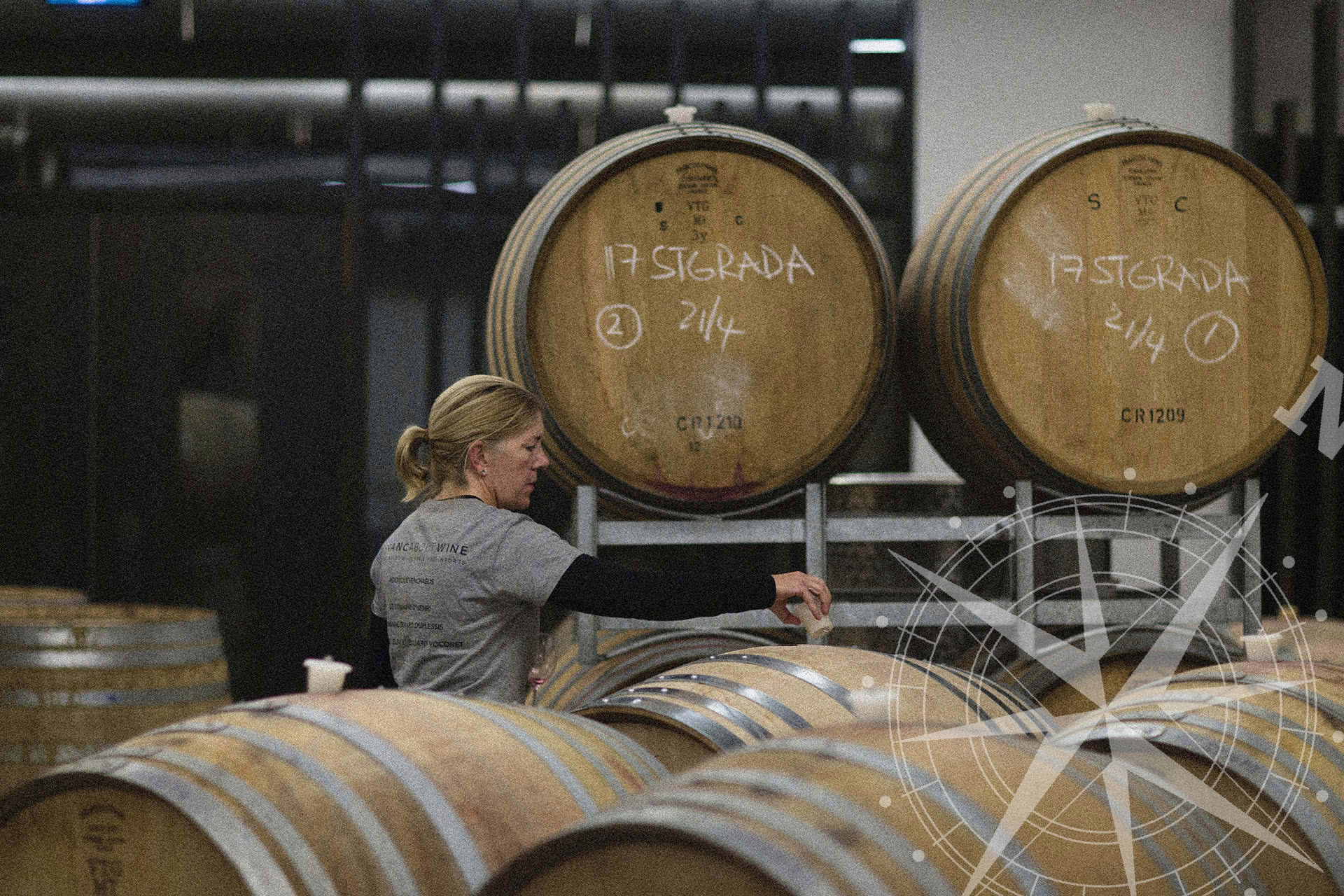 Winemaker Samantha Connew amongst barrels of wine
